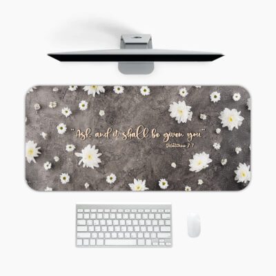 Dark grey desk pad featuring white daisies and the Bible verse "Ask and it shall be given to you" from Matthew 7:7 in golden cursive.