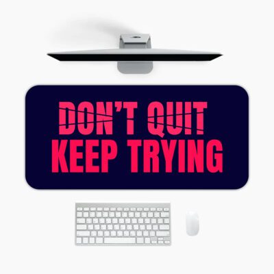 Infidu dark blue desk pad with bold red “DON’T QUIT, KEEP TRYING” motivational quote in the center.