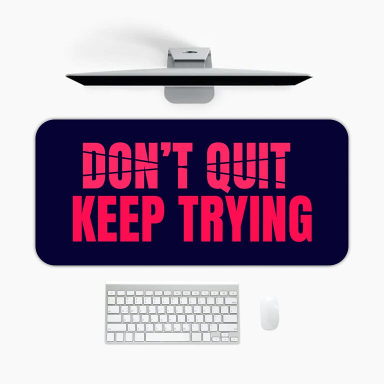 Infidu dark blue desk pad with bold red “DON’T QUIT, KEEP TRYING” motivational quote in the center.
