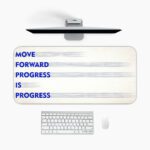 Infidu minimal cream desk pad with blue motivational quote "MOVE FORWARD PROGRESS IS PROGRESS" and subtle gray brush accents