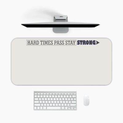 Infidu beige desk pad with motivational quote "HARD TIMES PASS STAY STRONG" and bold purple accent on a clean white background