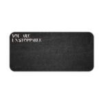 Infidu black desk pad with bold white "YOU ARE UNSTOPPABLE" text on a textured black background.