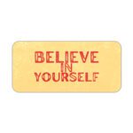 Infidu desk pad with bold red Believe in Yourself text on a soft yellow background and subtle vintage texture.
