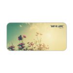 Vintage-style desk pad with wildflowers, sunrise background, and the quote “GOD IS LOVE” in black font.