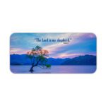 Scenic desk pad with Bible verse and serene lake, tree, and pastel sky design.