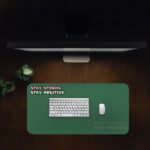 Infidu dark green desk pad with white and pink motivational quote on a chalkboard-style background