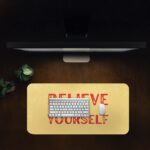 Infidu desk pad with bold red Believe in Yourself text on a soft yellow background and subtle vintage texture.