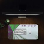 Infidu motivational desk pad with geometric burst and “CONSISTENCY” quote in purple on a light blue and white background.