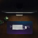 Infidu galaxy desk pad with “YOU ARE STRONG KEEP GOING” quote on a blue to purple starry background.