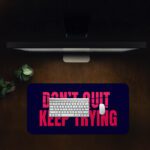 Infidu dark blue desk pad with bold red “DON’T QUIT, KEEP TRYING” motivational quote in the center.