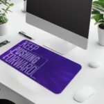 Infidu desk pad with bold “Keep Pushing Forward” quote on purple background and vintage art-inspired design.
