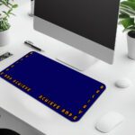 Infidu blue desk pad with “Believe and Achieve” quote in bold orange text on a deep blue background.