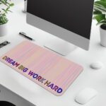Infidu desk pad with pastel stripes and DREAM BIG WORK HARD quote on beige background.