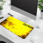 Infidu bold yellow desk pad with black grunge edges and motivational quote “STOP THINKING START DOING” in a vintage art style.