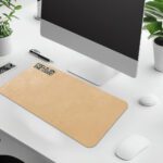 Infidu beige desk pad with motivational “Focus on the Good” quote in bold black text on a soft tan background.