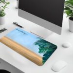 Infidu beach desk pad with tropical leaves and Isaiah 41:10 Bible verse on a soft sky and sand background.