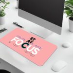 Infidu pastel pink desk pad with bold “STAY FOCUS” quote in colorful typography