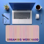 Infidu desk pad with pastel stripes and DREAM BIG WORK HARD quote on beige background.