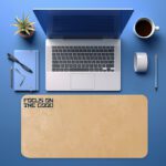 Infidu beige desk pad with motivational “Focus on the Good” quote in bold black text on a soft tan background.