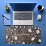 Dark grey desk pad featuring white daisies and the Bible verse "Ask and it shall be given to you" from Matthew 7:7 in golden cursive.