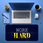 Infidu navy blue desk pad with bold “WORK HARD” text in white and yellow on a textured background.