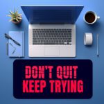 Infidu dark blue desk pad with bold red “DON’T QUIT, KEEP TRYING” motivational quote in the center.