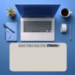 Infidu beige desk pad with motivational quote "HARD TIMES PASS STAY STRONG" and bold purple accent on a clean white background