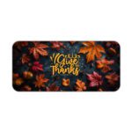 Vintage-style autumn desk pad with colorful fall leaves, acorns, and "Give Thanks" in golden-yellow calligraphy on a dark background.