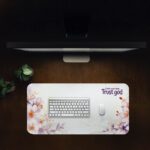 Infidu Trust God desk pad with pastel floral design and uplifting faith quote on a white background