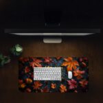 Vintage-style autumn desk pad with colorful fall leaves, acorns, and "Give Thanks" in golden-yellow calligraphy on a dark background.