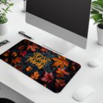 Vintage-style autumn desk pad with colorful fall leaves, acorns, and "Give Thanks" in golden-yellow calligraphy on a dark background.