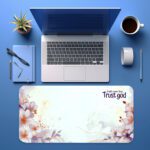 Infidu Trust God desk pad with pastel floral design and uplifting faith quote on a white background