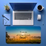 Infidu Sunrise Countryside Desk Pad featuring vintage art of green fields, glowing sunrise, and Bible verse "I can do all things through Christ."
