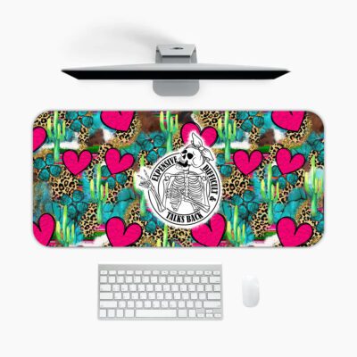 Infidu Western desk pad with skeleton cowboy, cactus, leopard print, pink hearts, and “Roped in but still wild” quote.