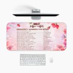 Infidu floral desk pad with soft pink and lavender blooms, featuring Bible emergency numbers for women on a light pink gradient background