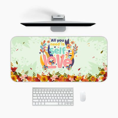 Infidu desk pad with “All You Need Is Self Love” quote, pastel green background, and colorful floral vintage art design.