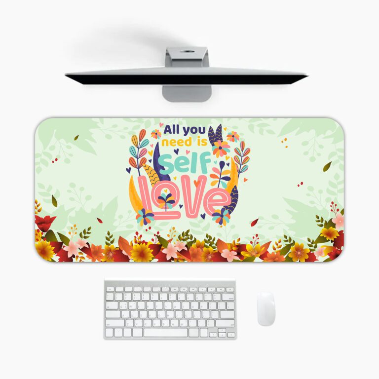 Infidu desk pad with “All You Need Is Self Love” quote, pastel green background, and colorful floral vintage art design.