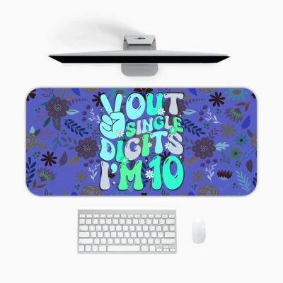 Infidu desk pad with “Out of Single Digits I’m 10” quote, peace sign, and playful floral patterns in vintage art style.