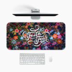 Dark desk pad with colorful red, pink, orange, blue, and purple flowers, featuring “Faith over Fear” in elegant white script, vintage art style.