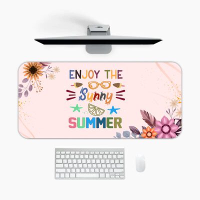 Pastel pink desk pad with floral corners, playful “Enjoy the Sunny Summer” text, sunglasses, sun rays, and vintage art style accents.