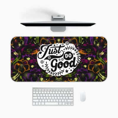 Dark floral desk pad with kaleidoscope pattern in purple, green, and orange, featuring “Just Do Good” quote in white framed text, vintage art style.
