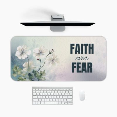 Watercolor desk pad with white flowers, pastel background, and bold “FAITH over FEAR” quote in vintage art style.