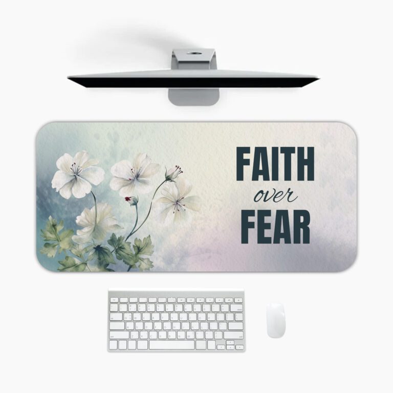 Watercolor desk pad with white flowers, pastel background, and bold “FAITH over FEAR” quote in vintage art style.