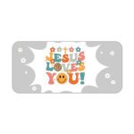 Light gray desk pad with “Jesus Loves You!” colorful text, surrounded by crosses, stars, hearts, smiley faces, and a happy emoji in vintage art style.