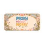 Desk pad with pastel floral border and colorful “Pray More, Worry Less” quote on a warm cream background in vintage art style.