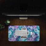 Infidu Ocean Desk Pad with seahorses, swirling ocean patterns, and bold quote on a colorful purple and teal background.