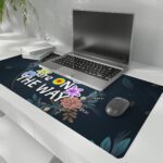 Infidu desk pad with floral vintage art and quote “Better Days Are On The Way” on a navy background with colorful flowers and golden lines.