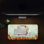 Infidu desk pad with “All You Need Is Self Love” quote, pastel green background, and colorful floral vintage art design.