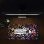 Dark desk pad with colorful red, pink, orange, blue, and purple flowers, featuring “Faith over Fear” in elegant white script, vintage art style.