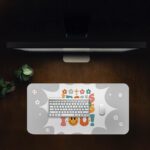 Light gray desk pad with “Jesus Loves You!” colorful text, surrounded by crosses, stars, hearts, smiley faces, and a happy emoji in vintage art style.